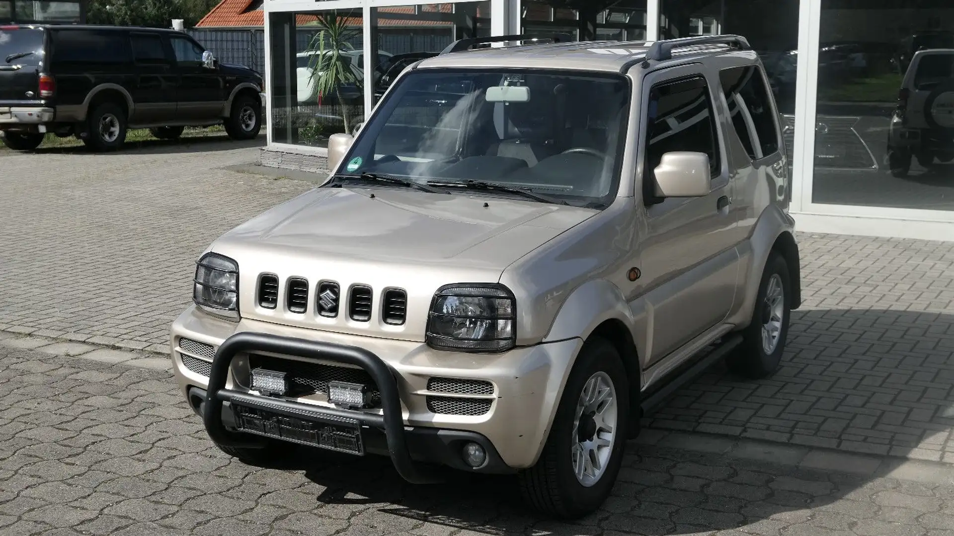 Suzuki Jimny 1.3 4WD Comfort/Sitzheizung/Klimaanlage Gold - 1
