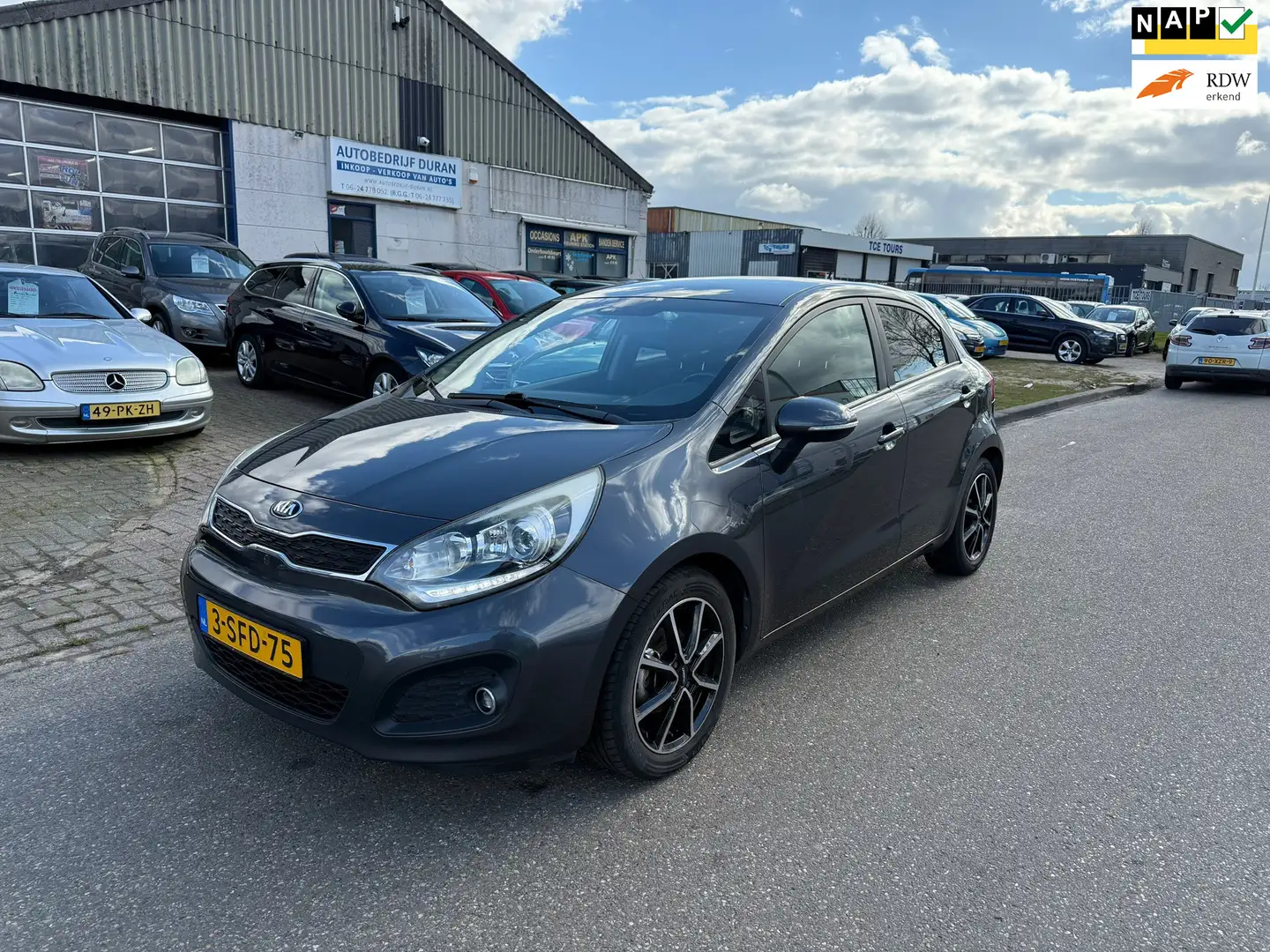 Kia Rio 1.2 CVVT Super Pack 5-Drs Clima! Bj:2013 NAP! Grijs - 1