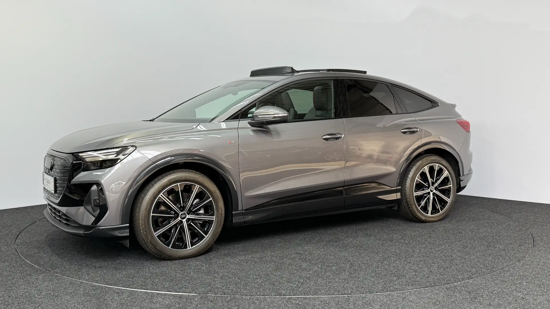 Audi Q4 e-tron 40 Sportback~ Nieuw!! ~ Warmtepomp ~ Stock Gris - 1