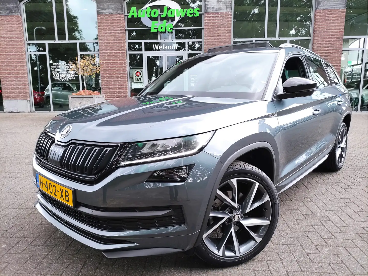 Skoda Kodiaq 1.5 TSI DSG Sportline Business Panoramadak - Adapt Gris - 1