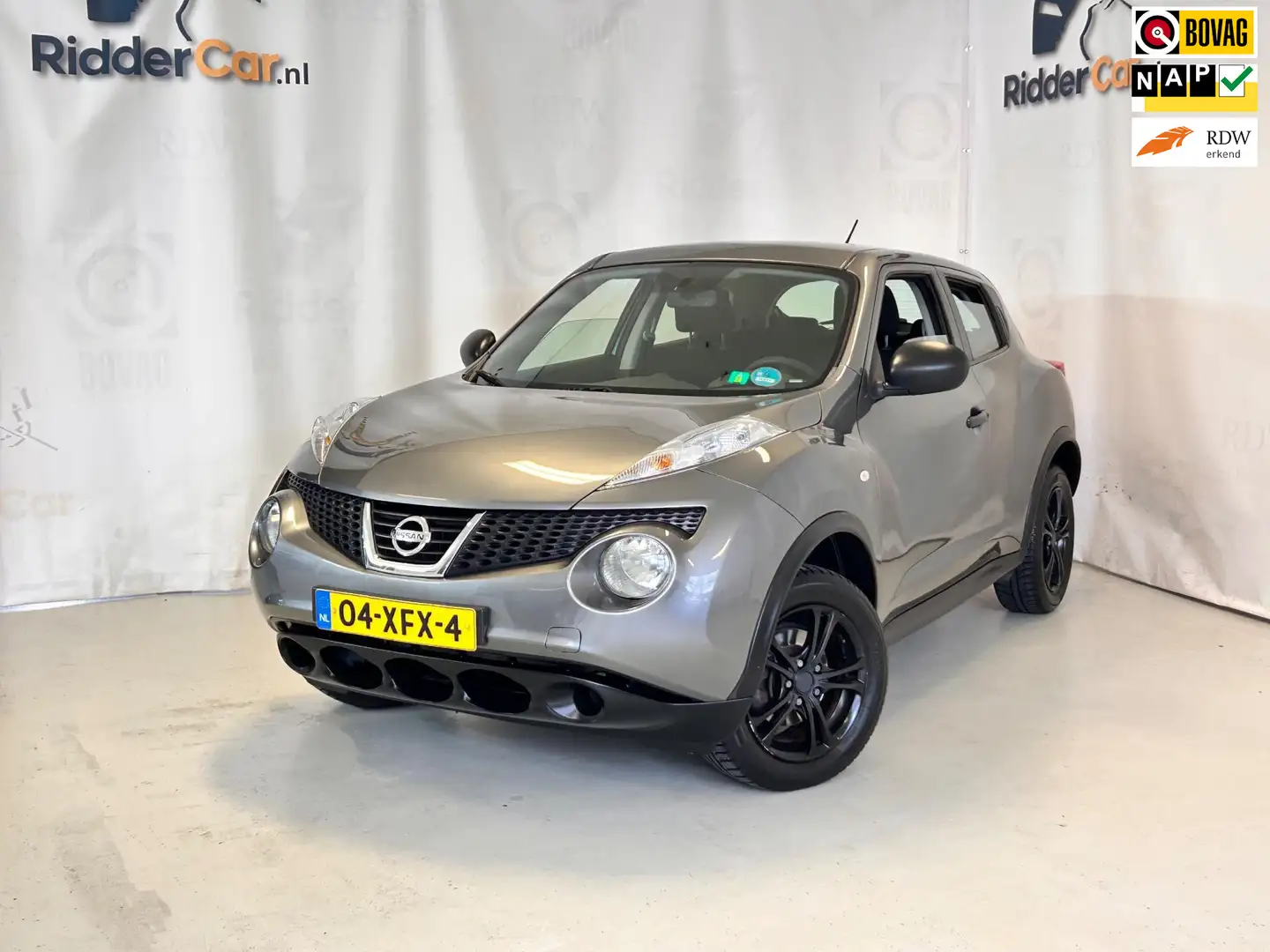 Nissan Juke 1.6 Visia|1E EIG|NAP|PARK SENS|AIRCO|ELEK RAMEN|AP Grau - 1