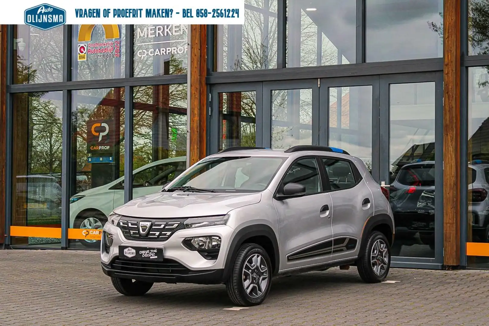 Dacia Spring Comfort Plus 27 kWh|CCS|Navi|Camera|Leer|Airco Argento - 1