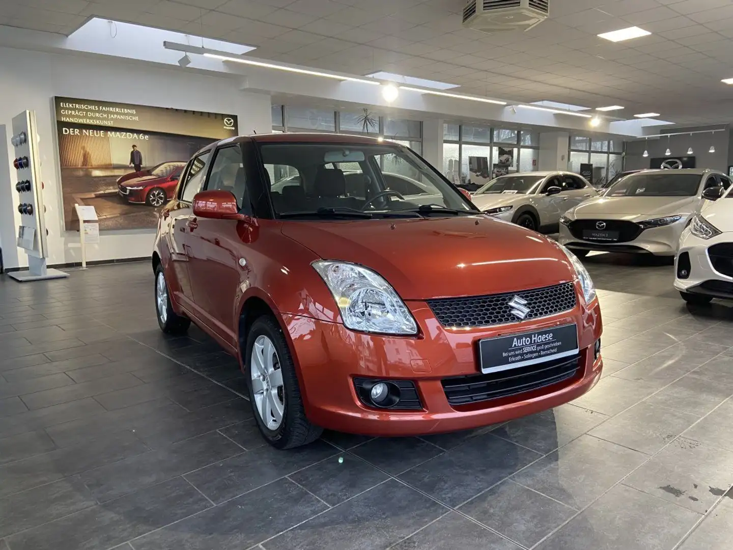Suzuki Swift 1.3 92PS Comfort 4x4 AHK SZH 4 SEASONS Com Orange - 1