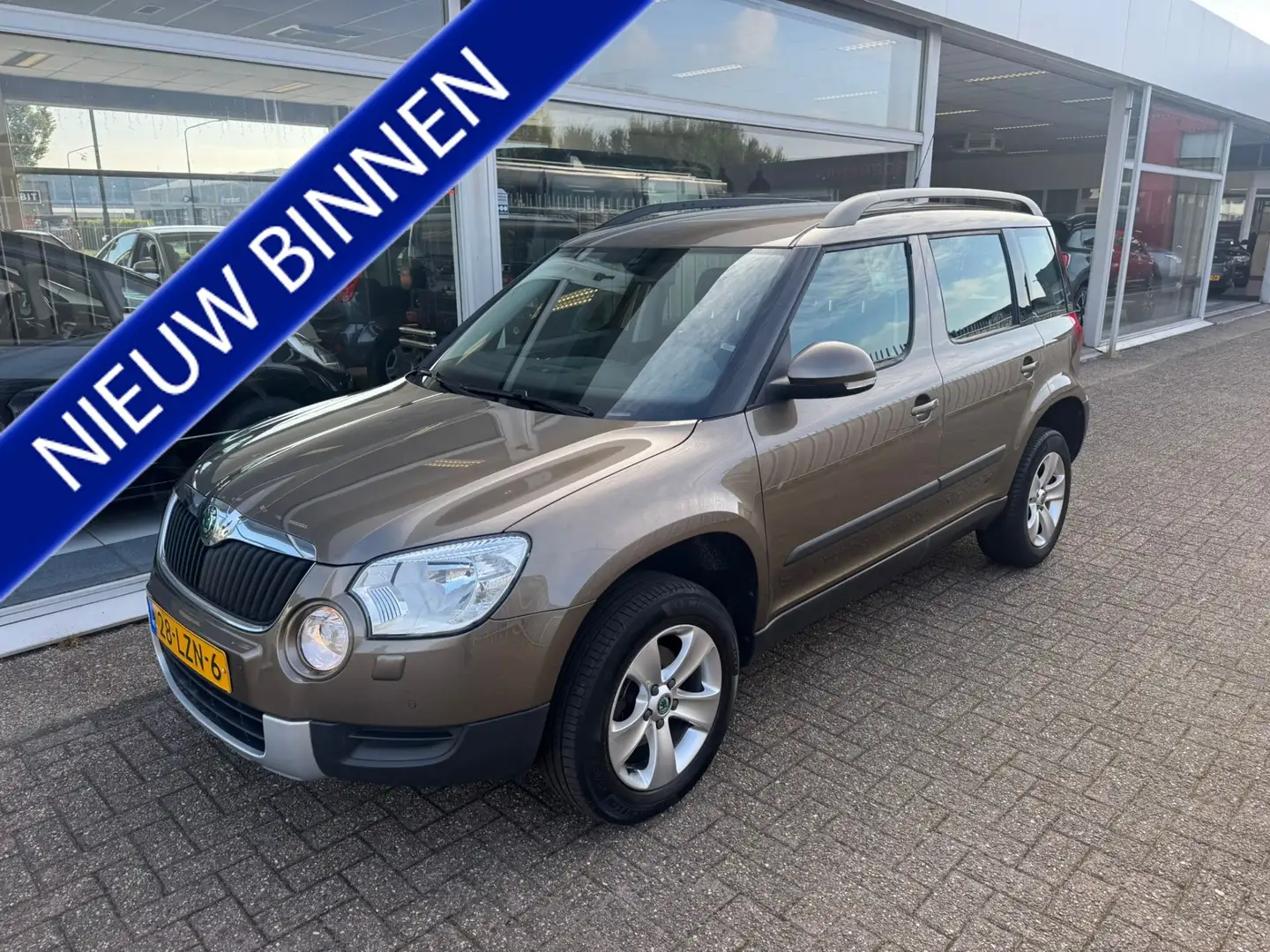 Skoda Yeti 1.2 TSI Ambition | 2e eigenaar | Airco | Cruise co Bruin - 1