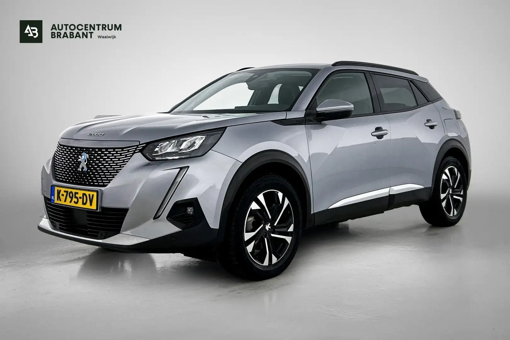 Peugeot e-2008 EV Allure 50 kWh (NAVIGATIE, CARPLAY, PDC, CRUISE, Gris - 1