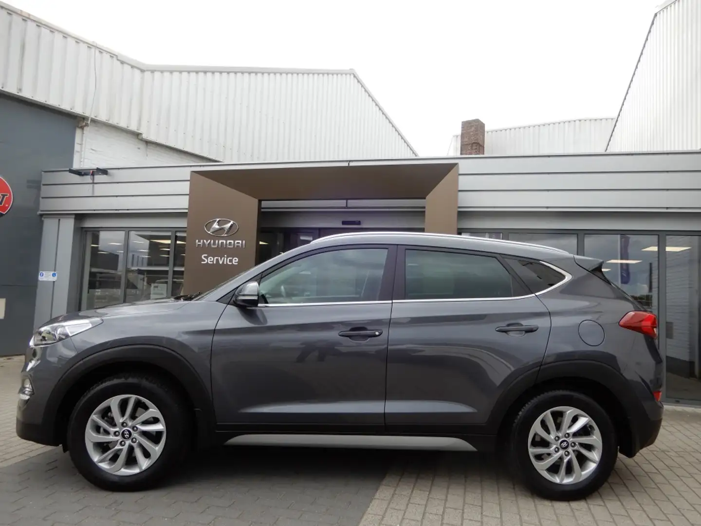 Hyundai TUCSON 1.6 GDi Comfort | Navigatie | Cruise control | Sto Gris - 2