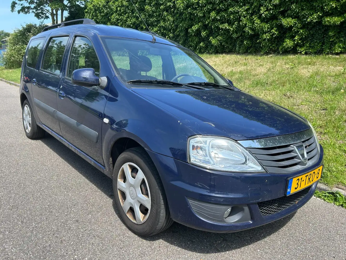 Dacia Logan MCV 1.6 MPI Lauréate - gebruikersschade rondom Blauw - 1
