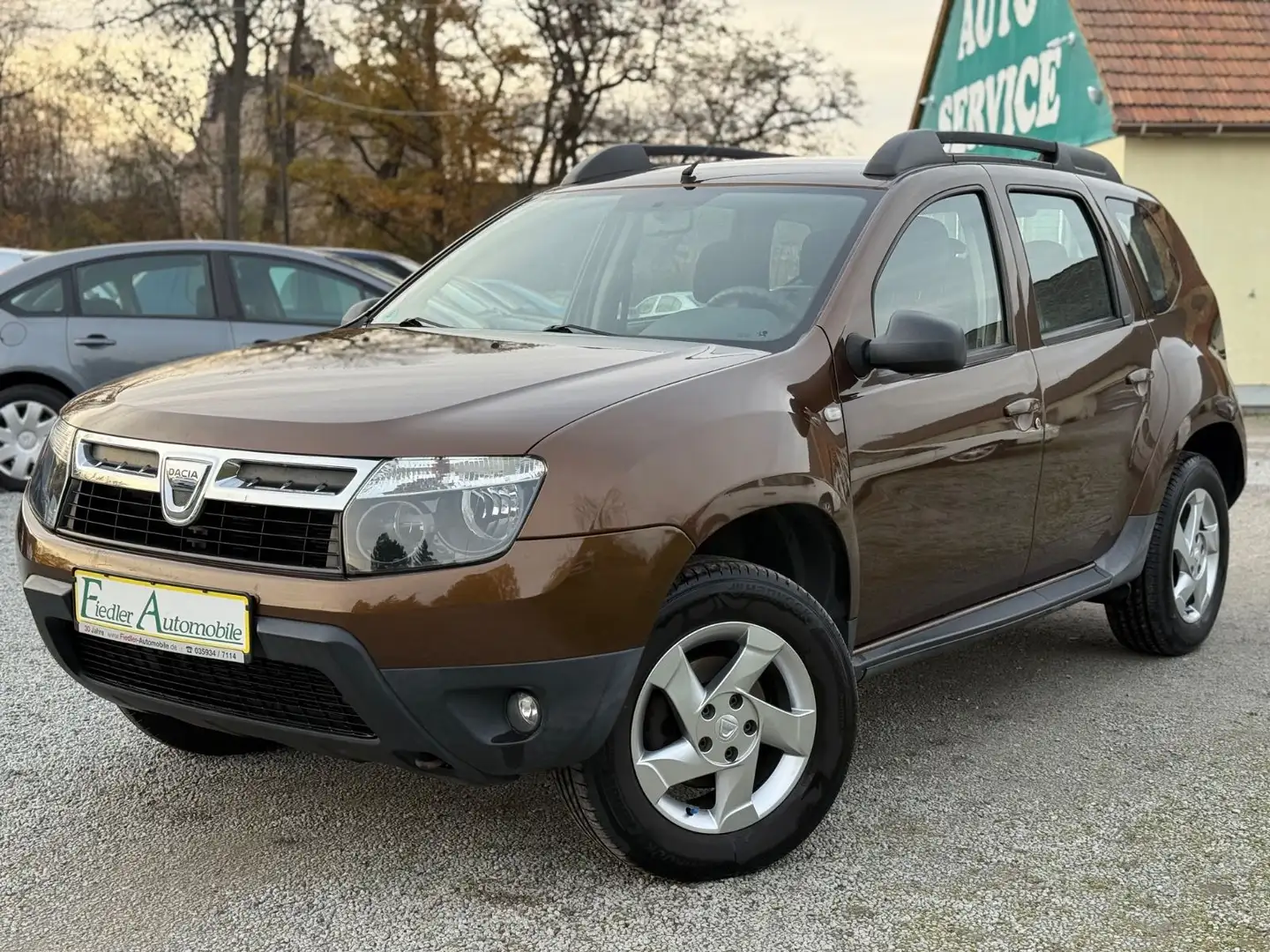 Dacia Duster 1.6 4x2 Lauréate / 1.HD / AHK / KLIMA / Bruin - 1