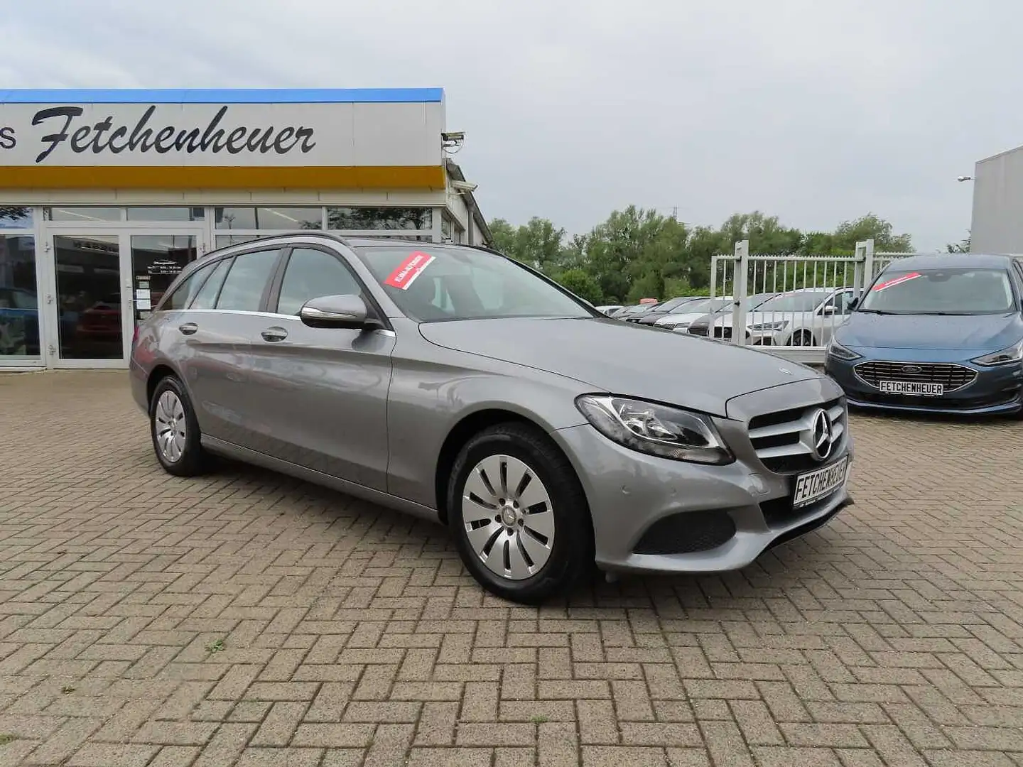 Mercedes-Benz C 180 T m. NAVI+AAC+SHZ+TEMP+PDC+ALU+P.-DACH+AHK Silber - 1