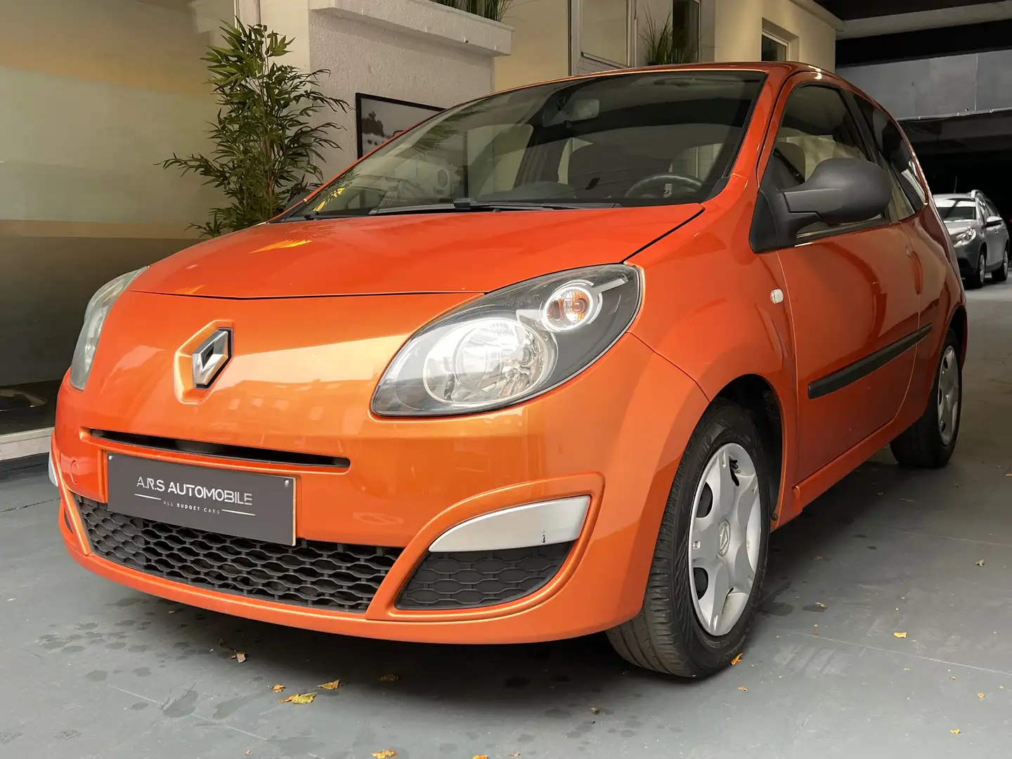 Renault Twingo 1.2i TempoMusic - Airco - Garantie 12m Oranje - 1