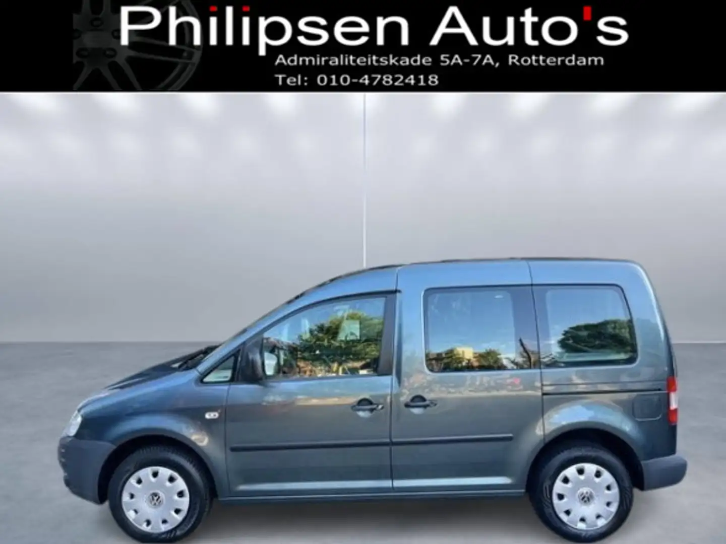 Volkswagen Caddy 1.6 Optive Comfort 5p. Grijs - 1