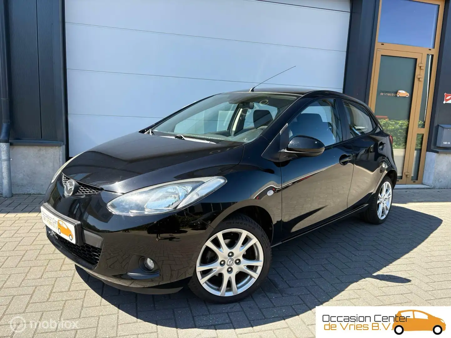 Mazda 2 1.3 Airco Velgen ElektrPakket Stoelverwarm Bluetoo Negro - 1