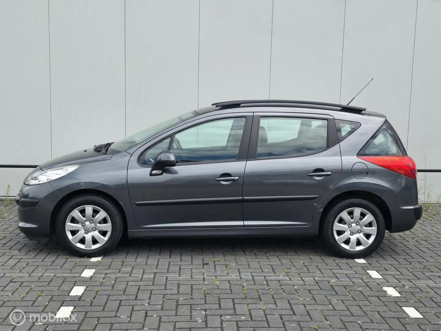 Peugeot 207 SW 1.4 VTi X-line 1e eigenaar! 90DKM! Grijs - 2