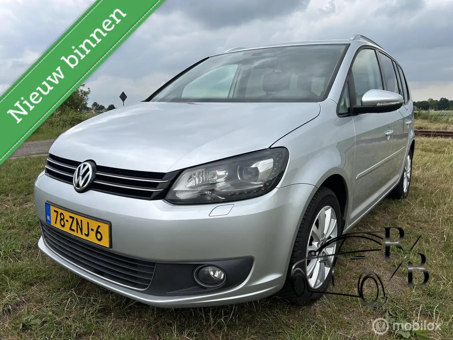 Volkswagen Touran 1.2 TSI Highline BlueMotion 7. Grijs - 1