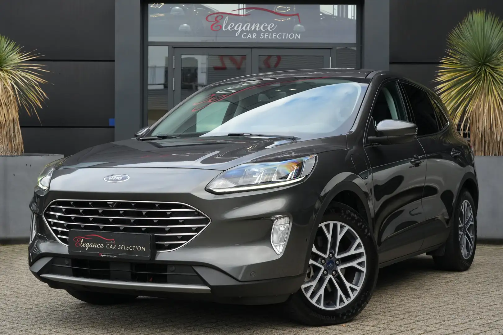 Ford Kuga 2.5 PHEV Titanium 225pk Navigatie/Stoelverwarming/ Gris - 1