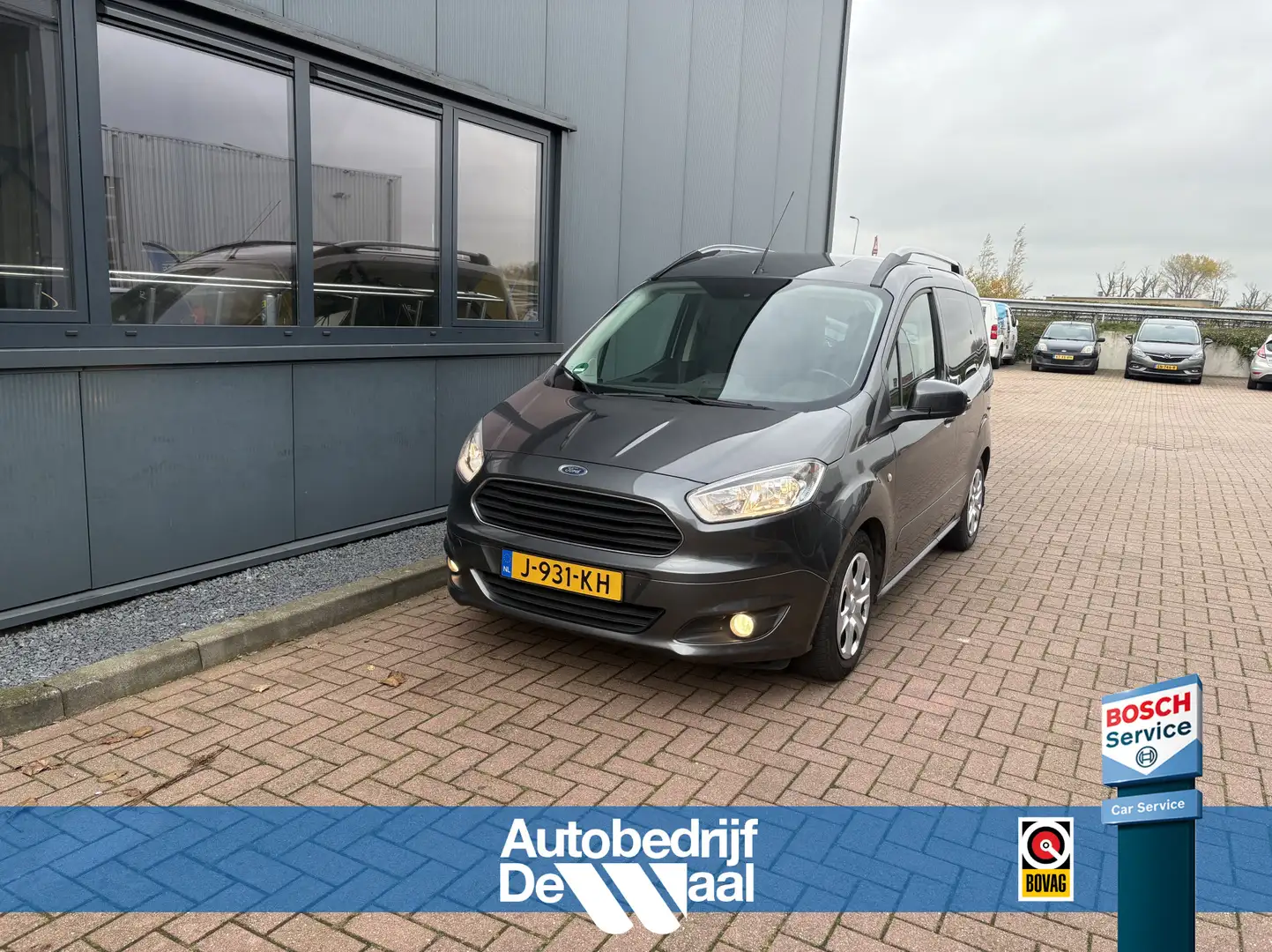 Ford Tourneo Courier 1.0 Ecoboost 100pk Titanium AIRCO/CRUISE/PDC/TREKH Gris - 1