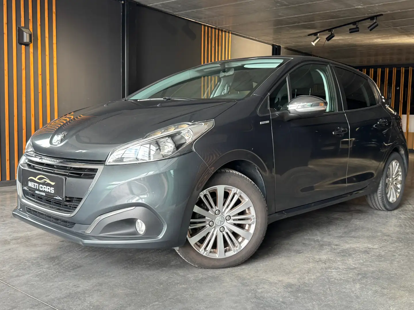 Peugeot 208 PureTech 82 Style | Navi | Parkeersensoren | Gris - 1