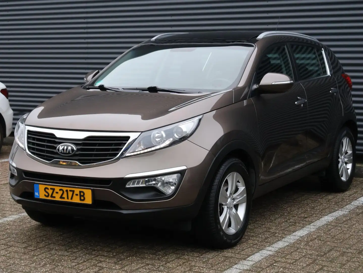 Kia Sportage 1.6 GDI|Pano|Airco|Cruise|PDC|Stoelverwarming Braun - 1