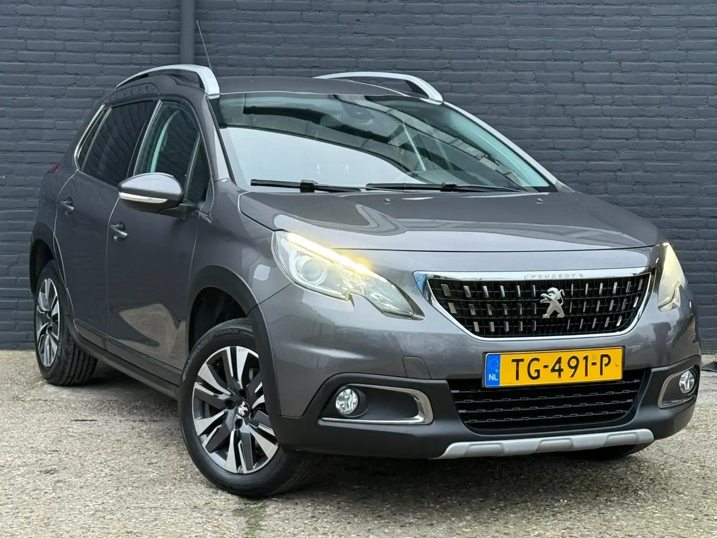 Peugeot 2008 1.2 PureTech Allure NAVI|CAMERA|PDC|CRUISE|TREKHAA Grijs - 2