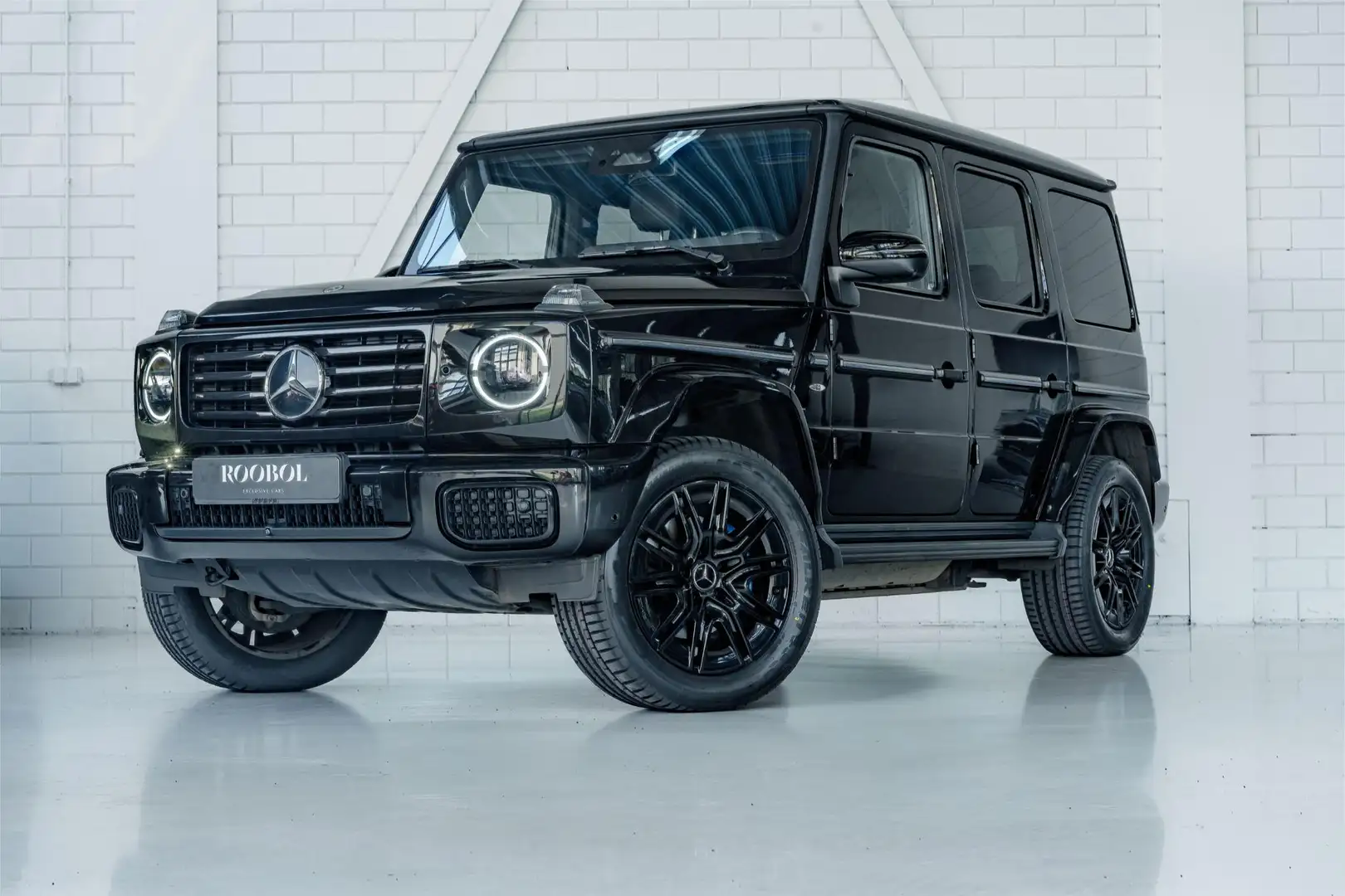 Mercedes-Benz G 580 Edition One l AMG l Burmester l Schuifdak l Bi-Col Schwarz - 1