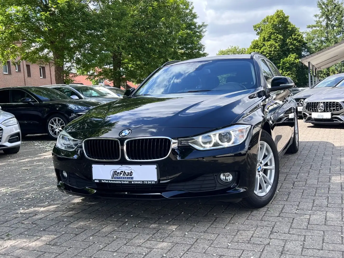 BMW 318 Touring d*AHK*PDC*NAVI*SHZ*MFKL* Schwarz - 1