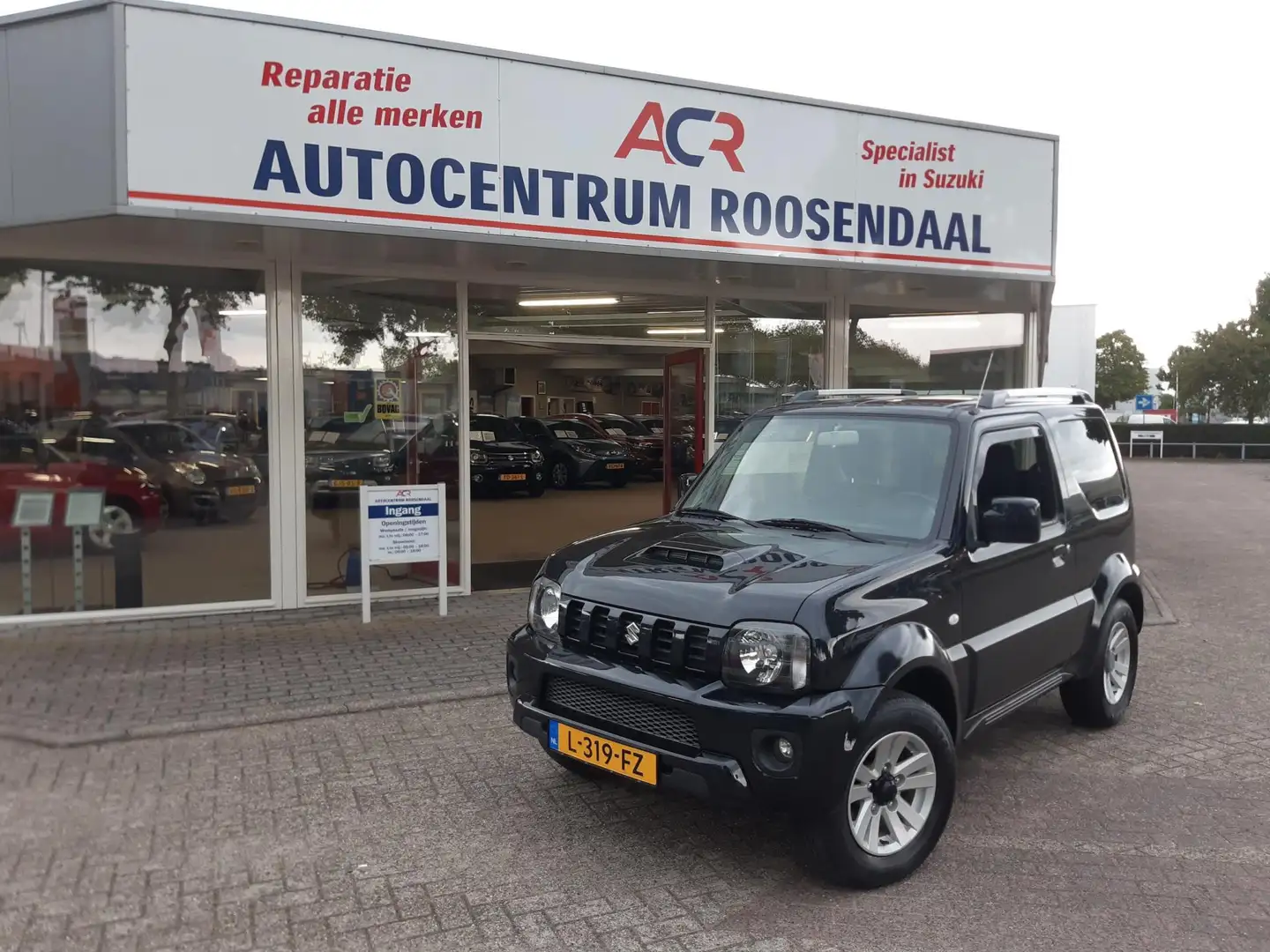 Suzuki Jimny 1.3 Exclusive LMV LEER TREKHAAK AIRCO zeer nette a Negro - 1