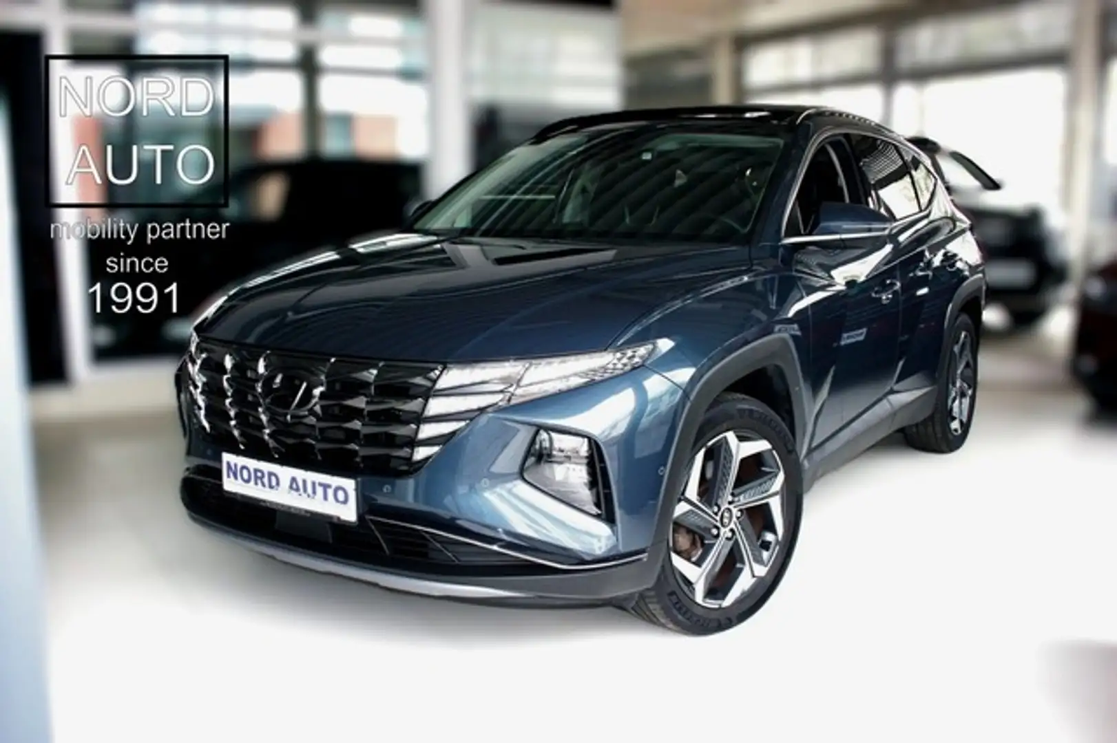 Hyundai TUCSON Tucson 1.6T-GDi Hybrid Prime 4WD Leder/Pano/Navi Grijs - 1