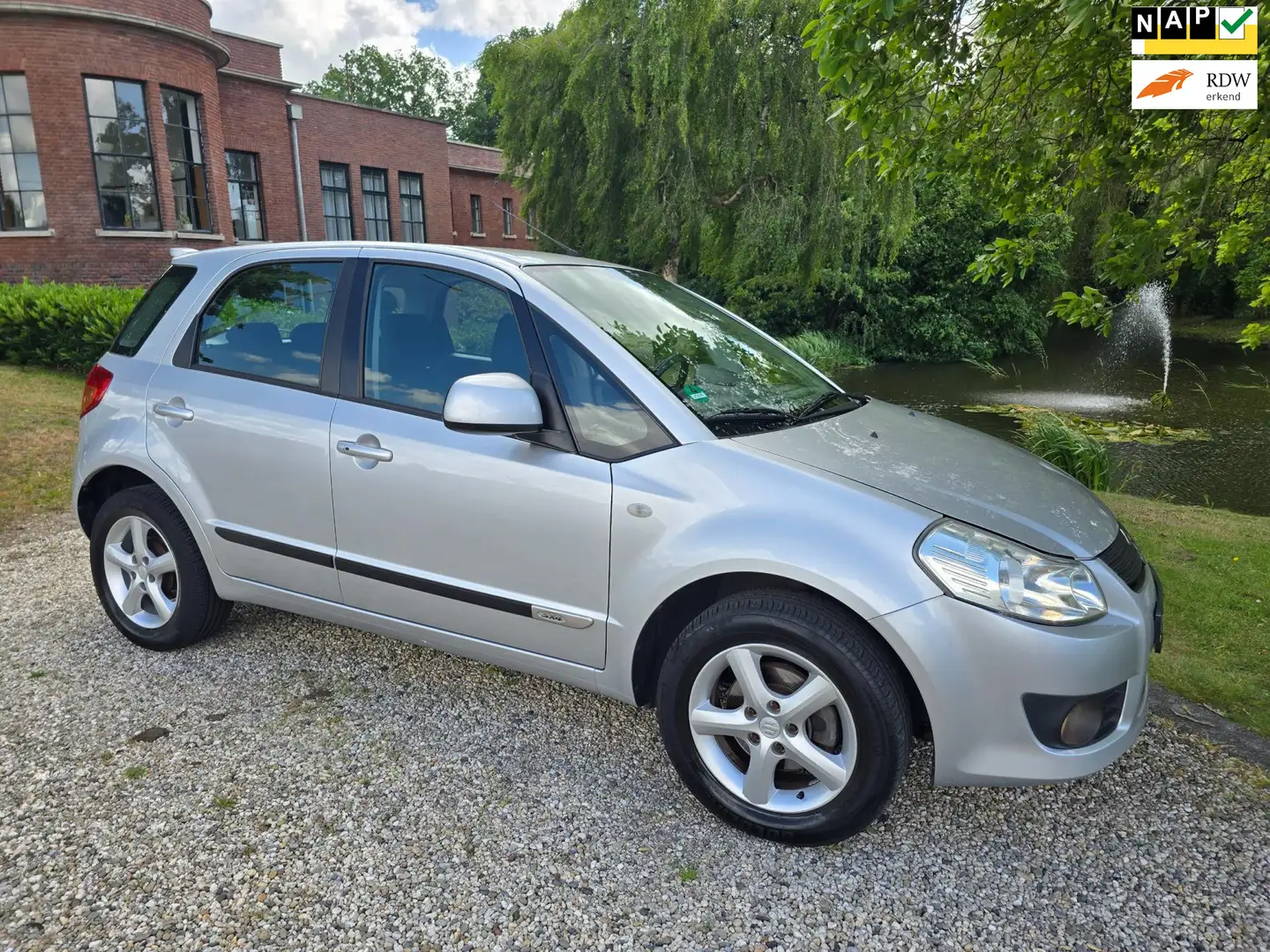 Suzuki SX4 1.6 Exclusive AIRCO *apk:06-2026* Grijs - 1