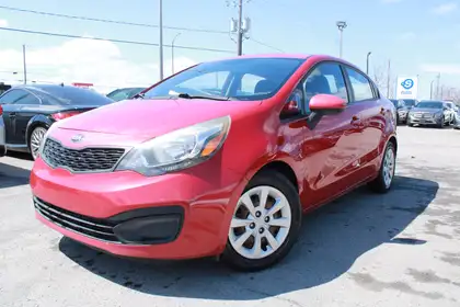 Red 2015 Kia Rio LX Sedan Front-Wheel Drive 6-Speed Manual