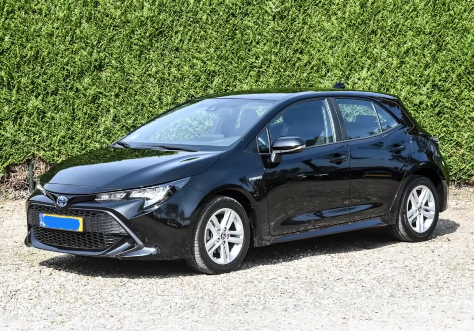 Toyota Corolla 1.8 Hybrid Active Zwart - 1
