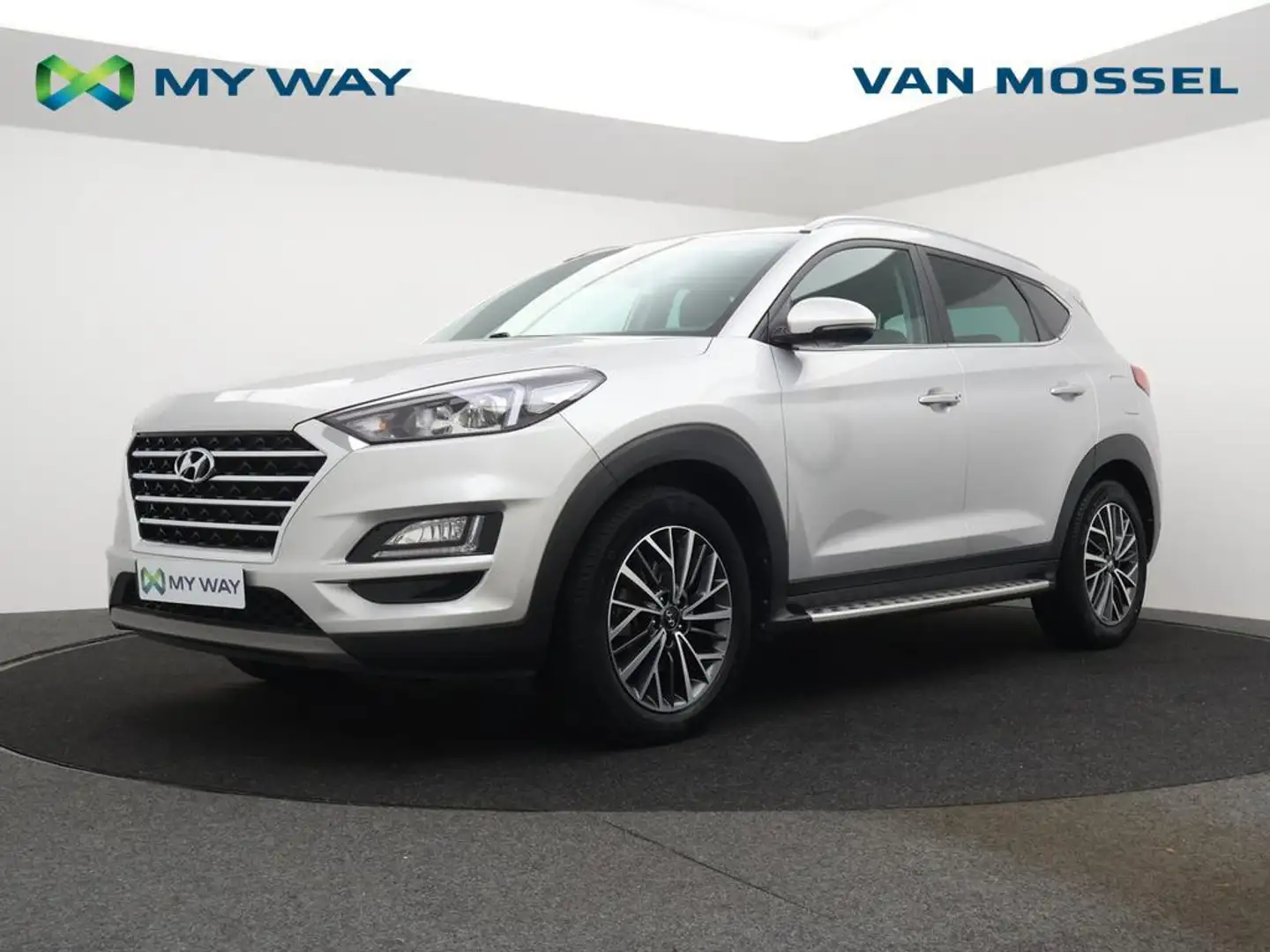 Hyundai TUCSON Tucson 1.6T-GDi MHEV 4WD Shine 180PK *NAVI*PDC*CRU Grijs - 1