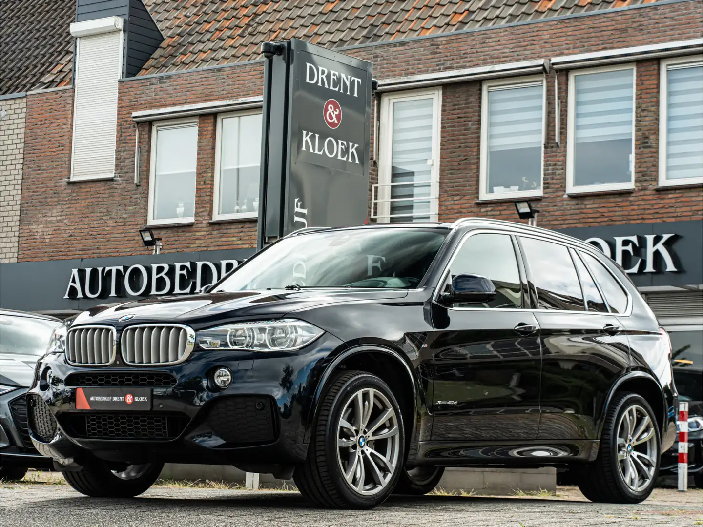 BMW X5 xDrive40d High Executive ORG NL PANO CAMERA HUD TR Zwart - 1
