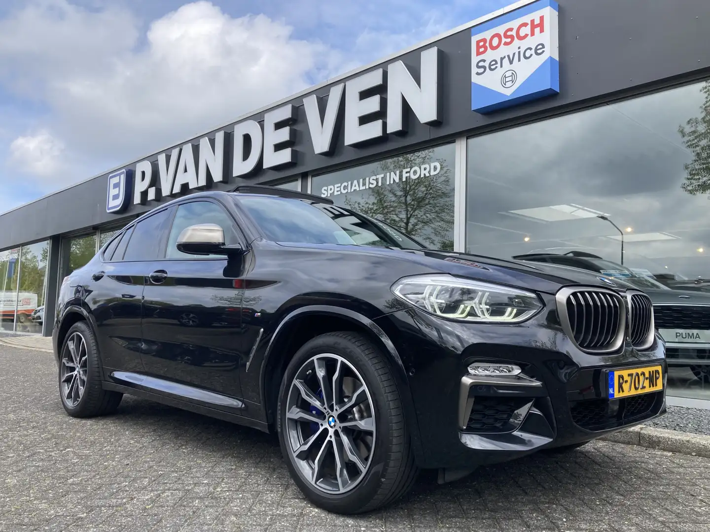 BMW X4 M40i High Executive 354pk/260kW Automaat 8-traps | Zwart - 1