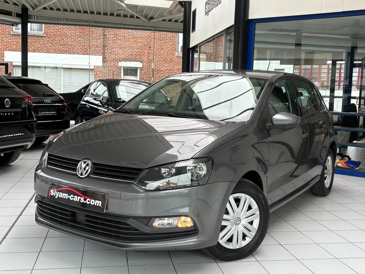 Volkswagen Polo 1.2 TSI *AUTO * CLIM DIGI * 1ER PROP * CARNET* Grijs - 1