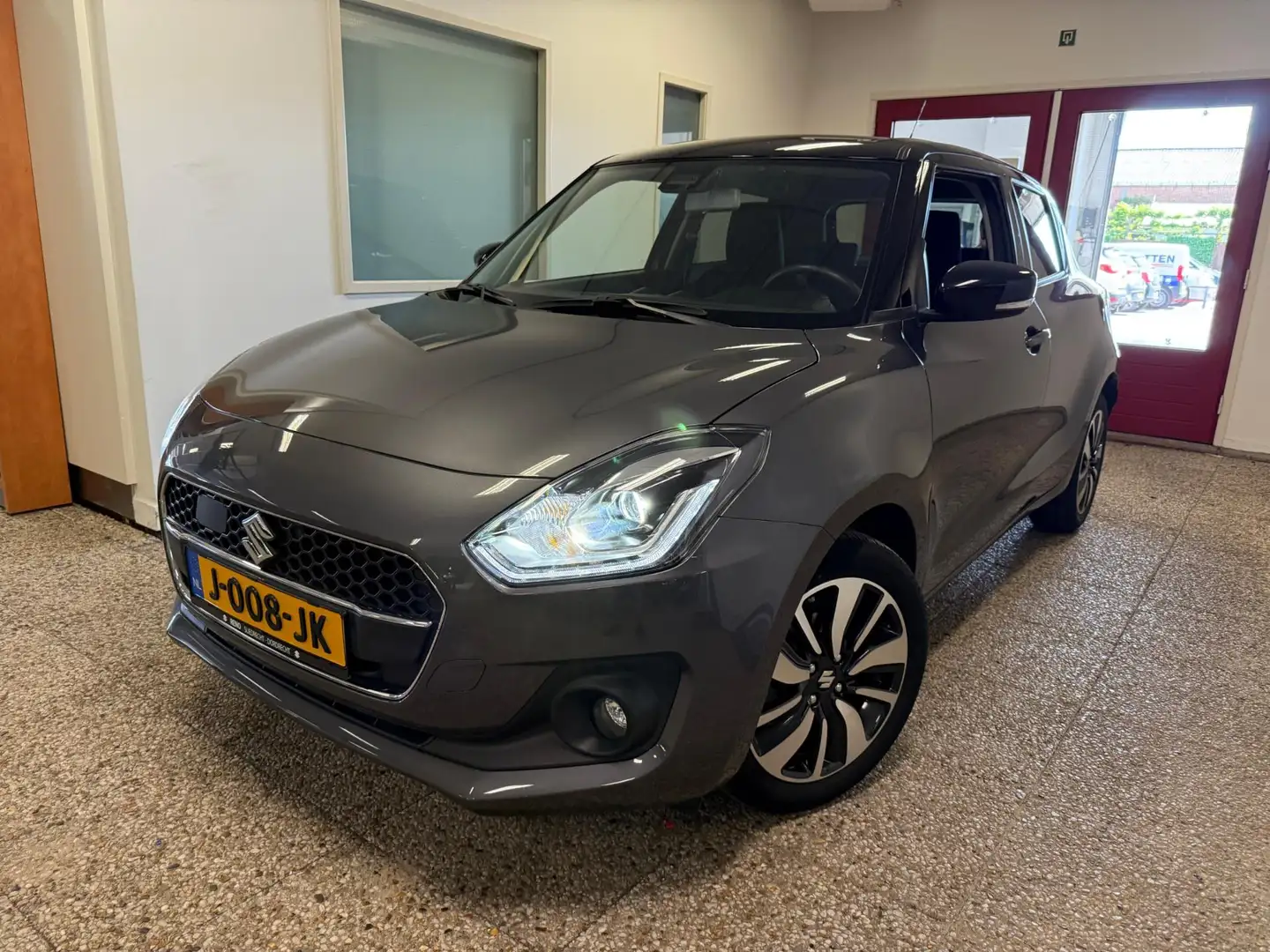 Suzuki Swift 1.2 Stijl Automaat 5-drs | Navi | 1e eigenaar Gris - 1