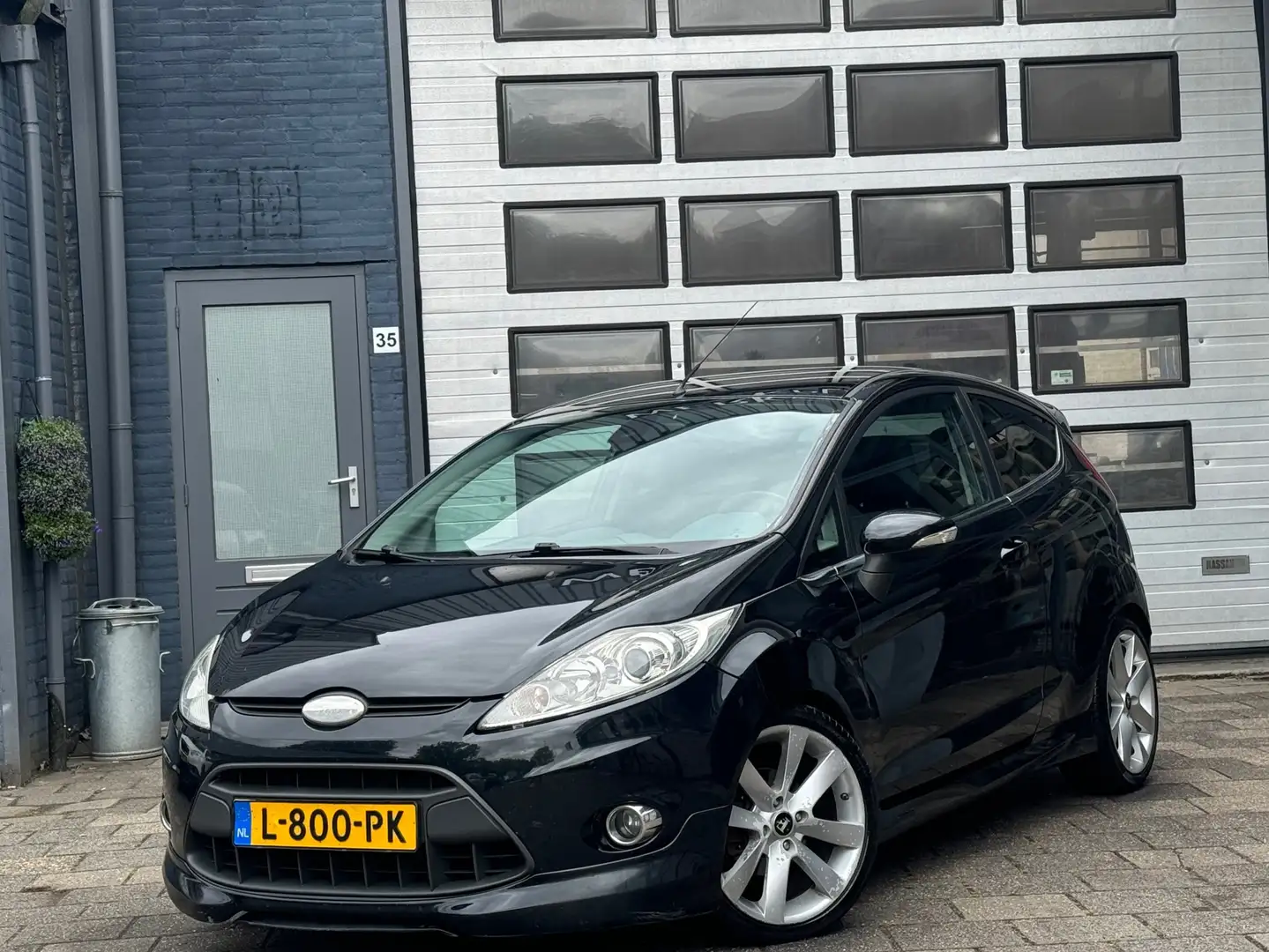 Ford Fiesta 1.25 Titanium | Clima | LMV | ST Pakket Zwart - 1
