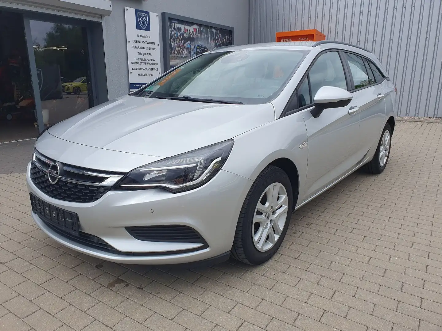 Opel Astra K Sports Tourer 150PS NAVI SITZHZ 8 Räder Silver - 1