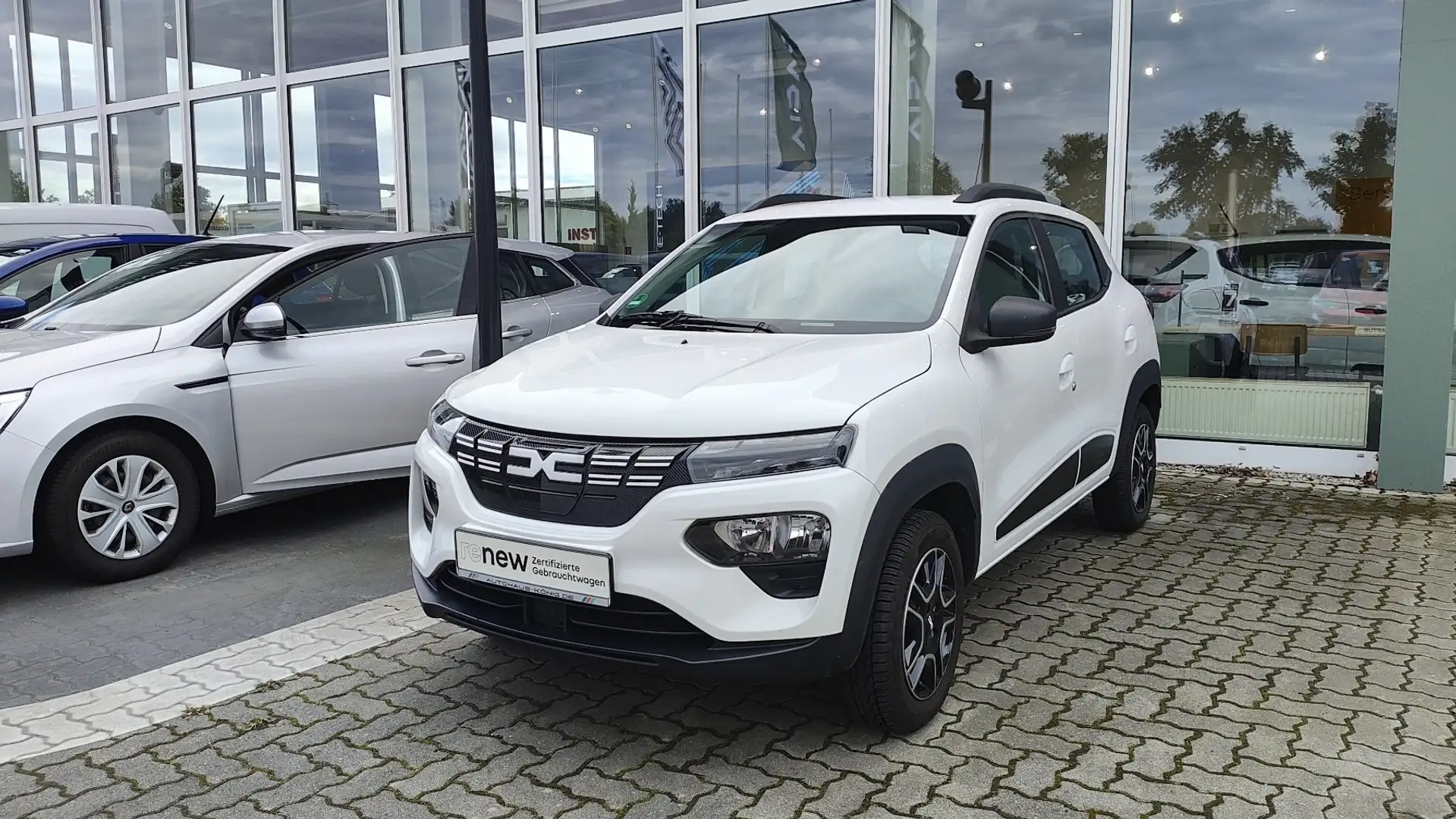 Dacia Spring Essential Automatik Allwetterräder, Klima Weiß - 1