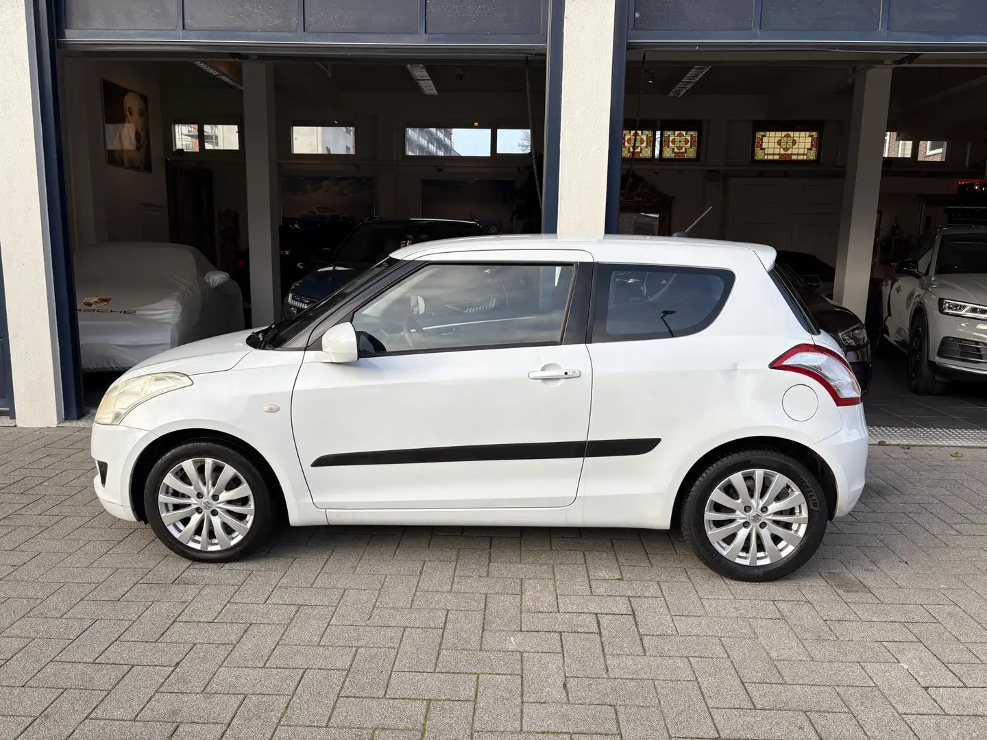 Suzuki Swift 1.2 Exclusive EASSS CLIMA/CRUISE/STOELVERW./NW APK Weiß - 2