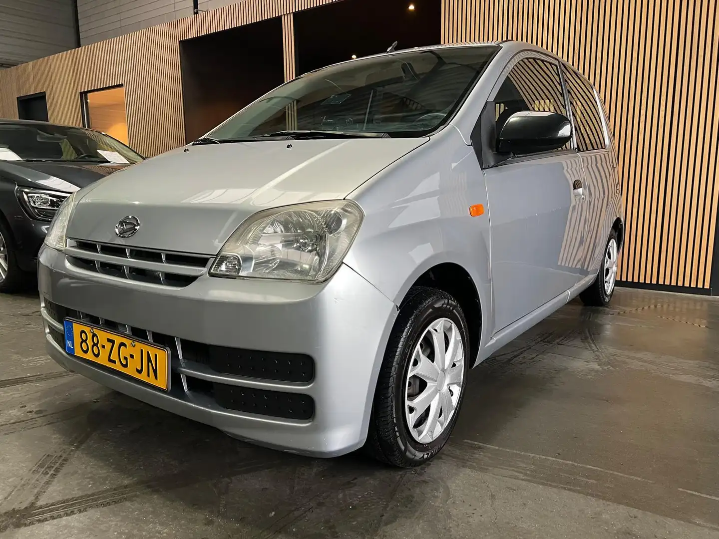 Daihatsu Cuore 1.0-12V Azure Automaat|Stuurbekrachtiging|NAP Grau - 1