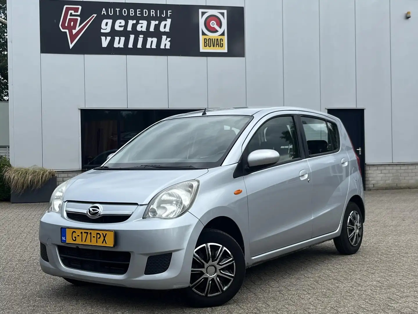 Daihatsu Cuore 1.0 Trend 5-DEURS AIRCO APK 02-2027 Grau - 1