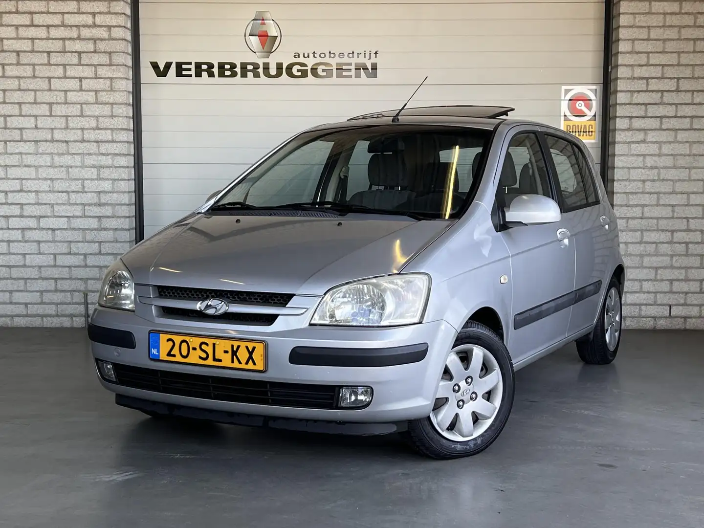 Hyundai Getz 1.3i Dynamic Sky | Trekhaak | Airco | Schuif/Kante Grijs - 1