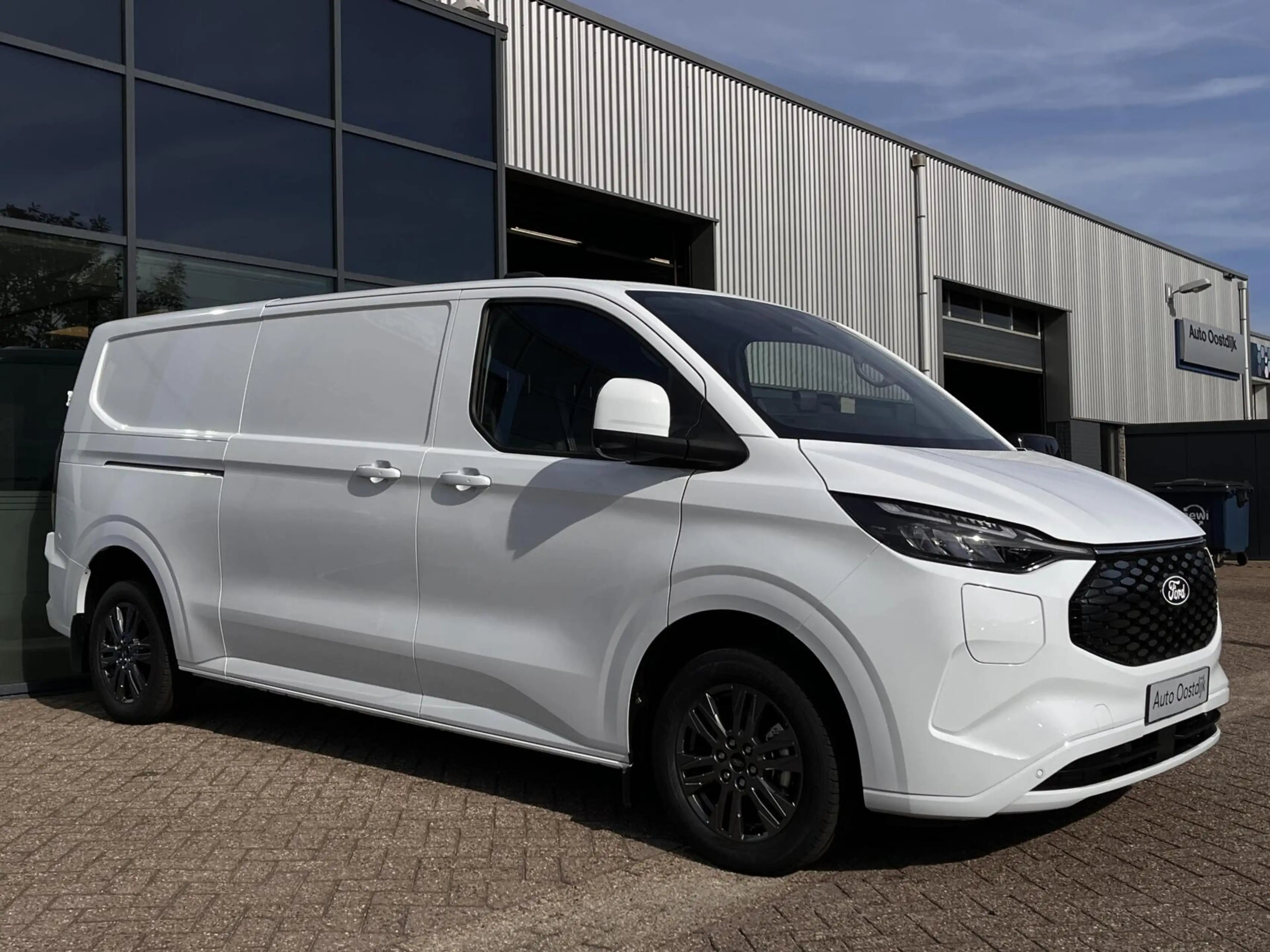 Ford Transit Custom E-Transit 340 L2H1 Limited 71 kWh 218PK 2x Schuifd — photo 8