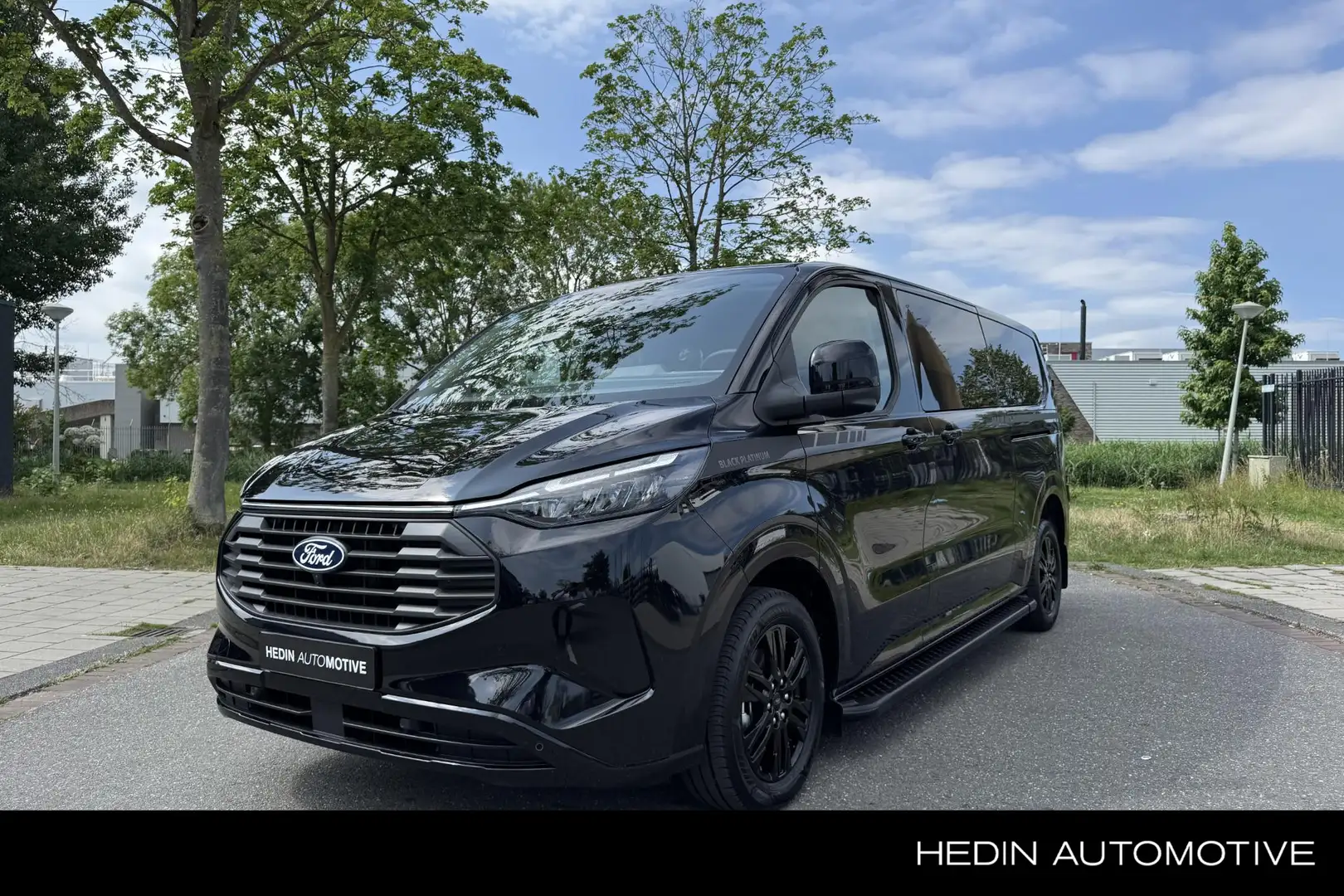 Ford Transit Custom 320 2.5 PHEV L2H1 Black Platinum DC Direct uit Voo Zwart - 1