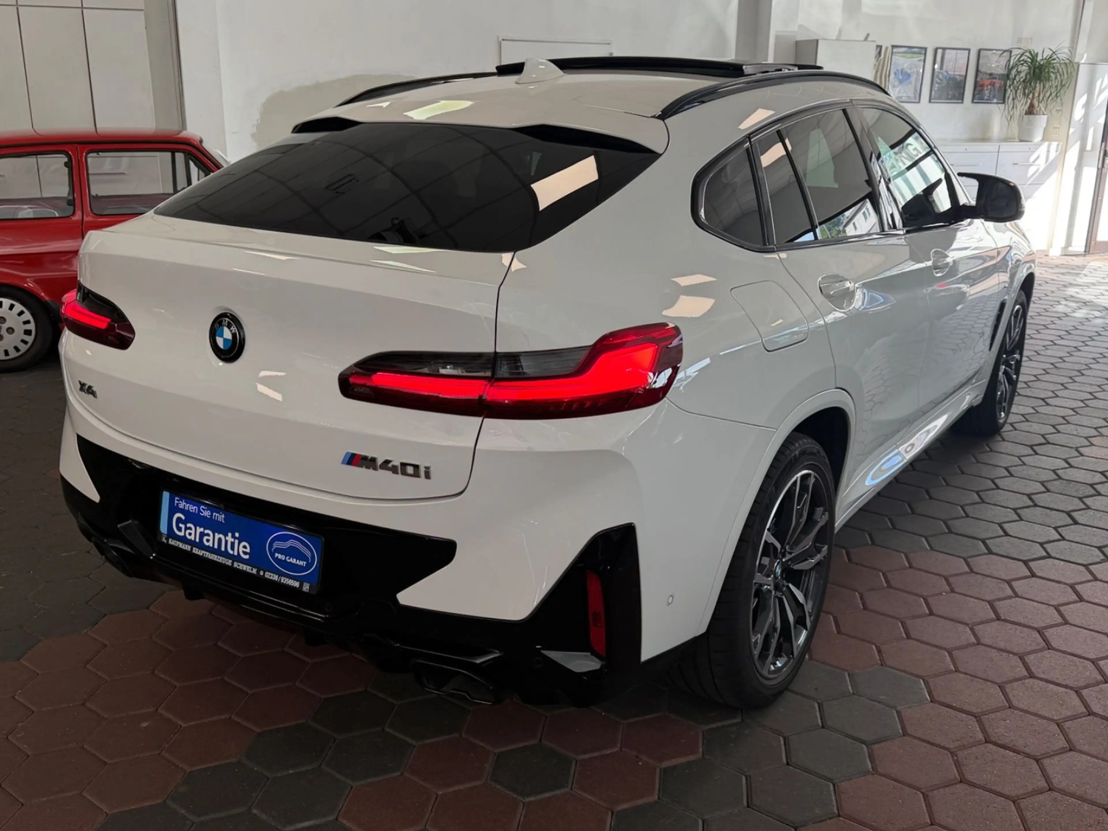 BMW X4 M i X-Drive*1-HAND*HUD*H&K*360*PANO*LED* — photo 4