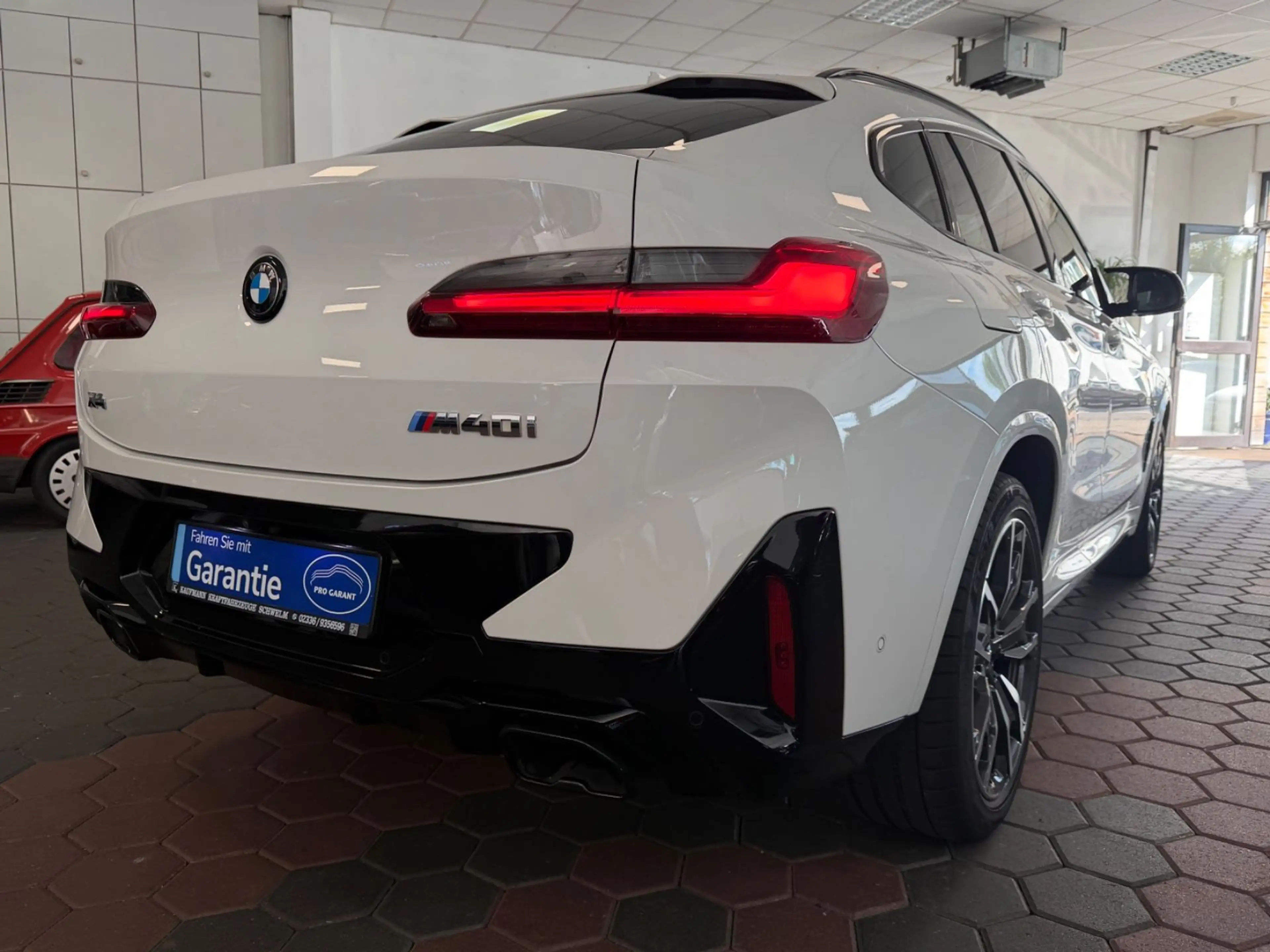BMW X4 M i X-Drive*1-HAND*HUD*H&K*360*PANO*LED* — photo 14