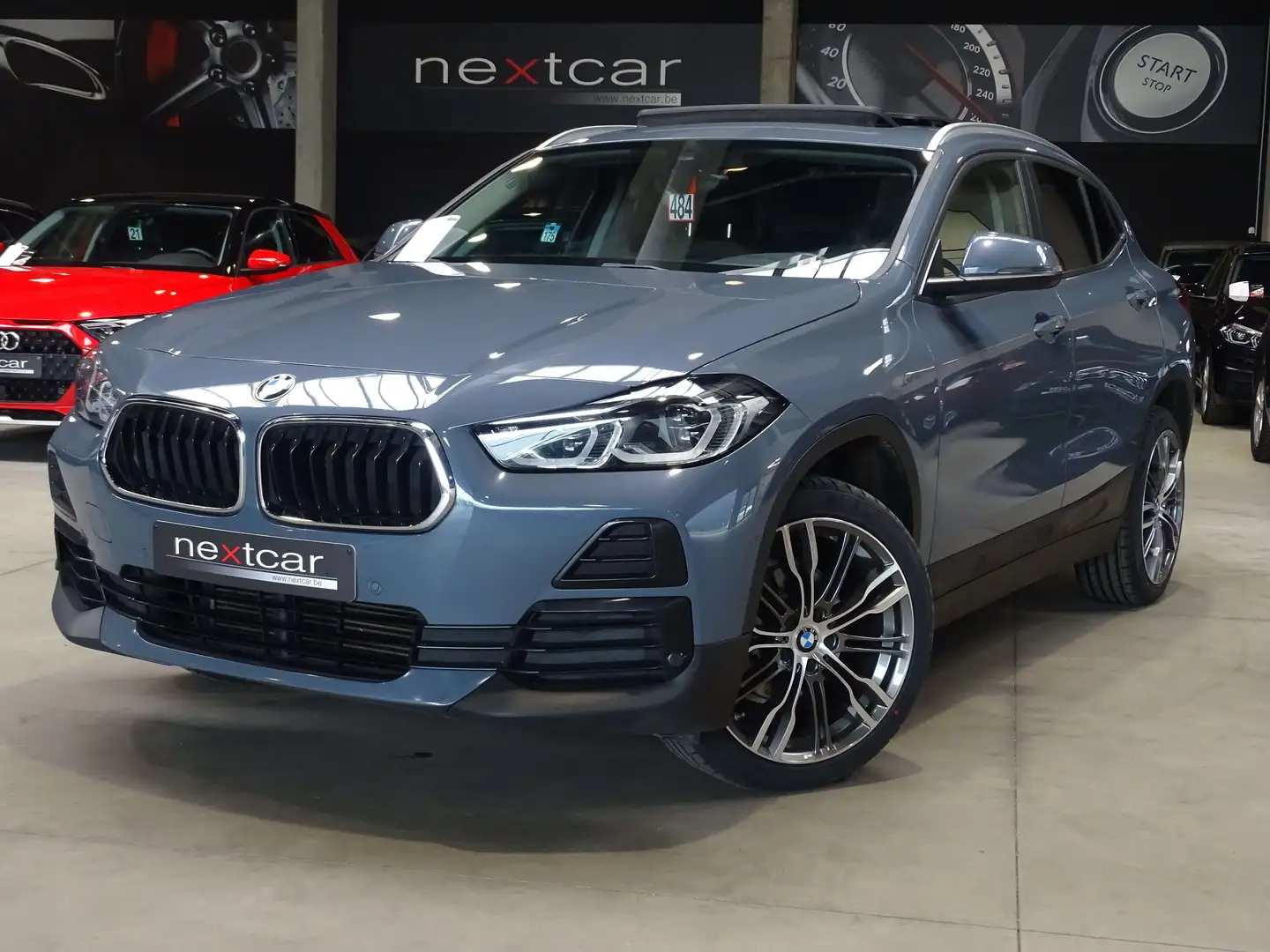 BMW X2 16d SDrive *T PANO-FULL LED-CUIR-NAVI* Grijs - 1