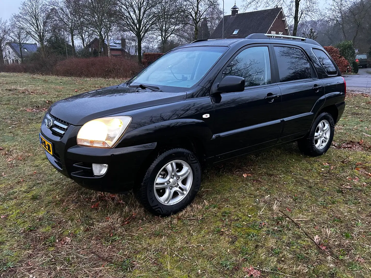 Kia Sportage 2.0 CVVT Comfort Zwart - 1