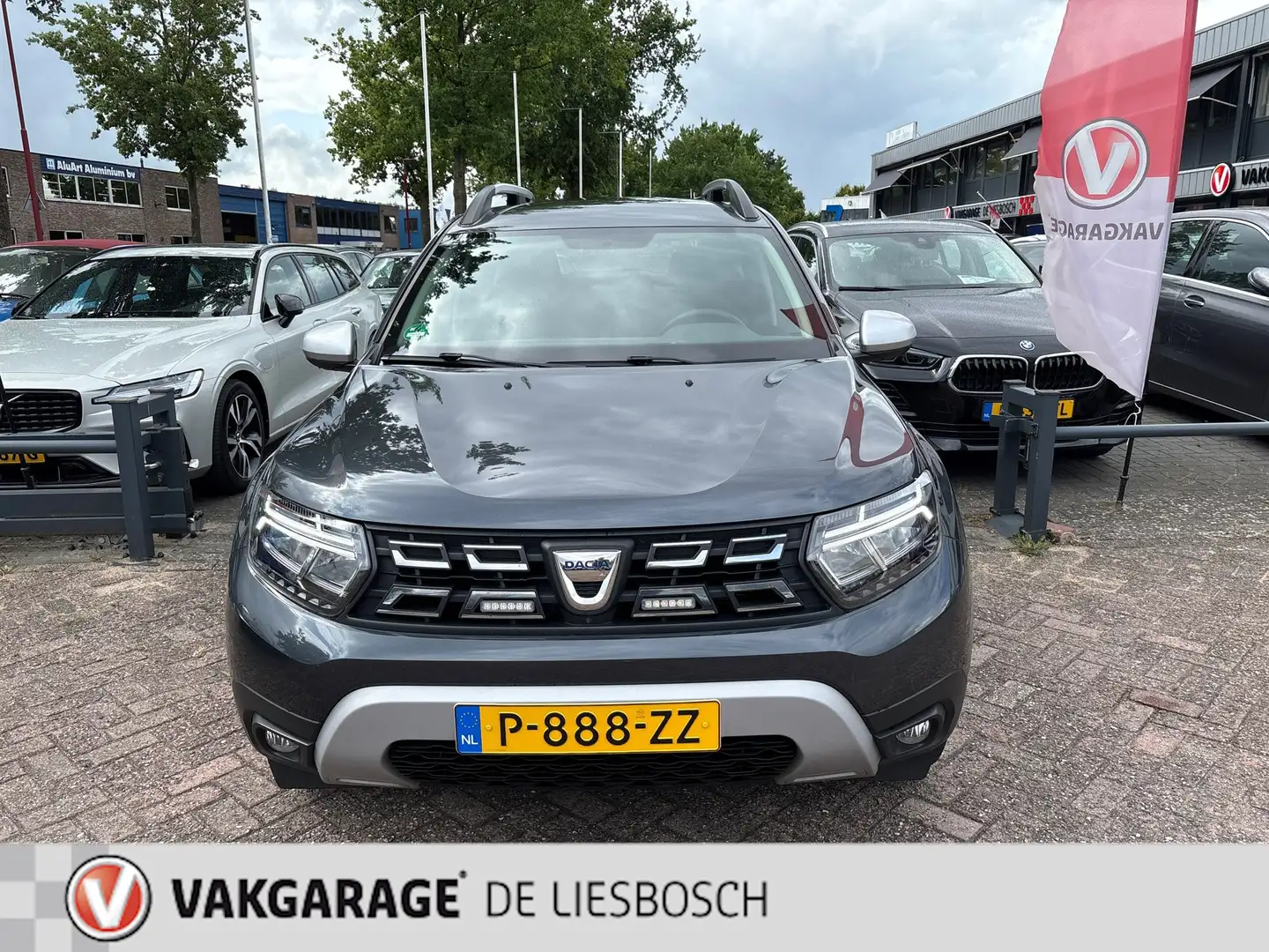 Dacia Duster 1.3 TCe Prestige automaat / navi / leer / camera / Grijs - 2