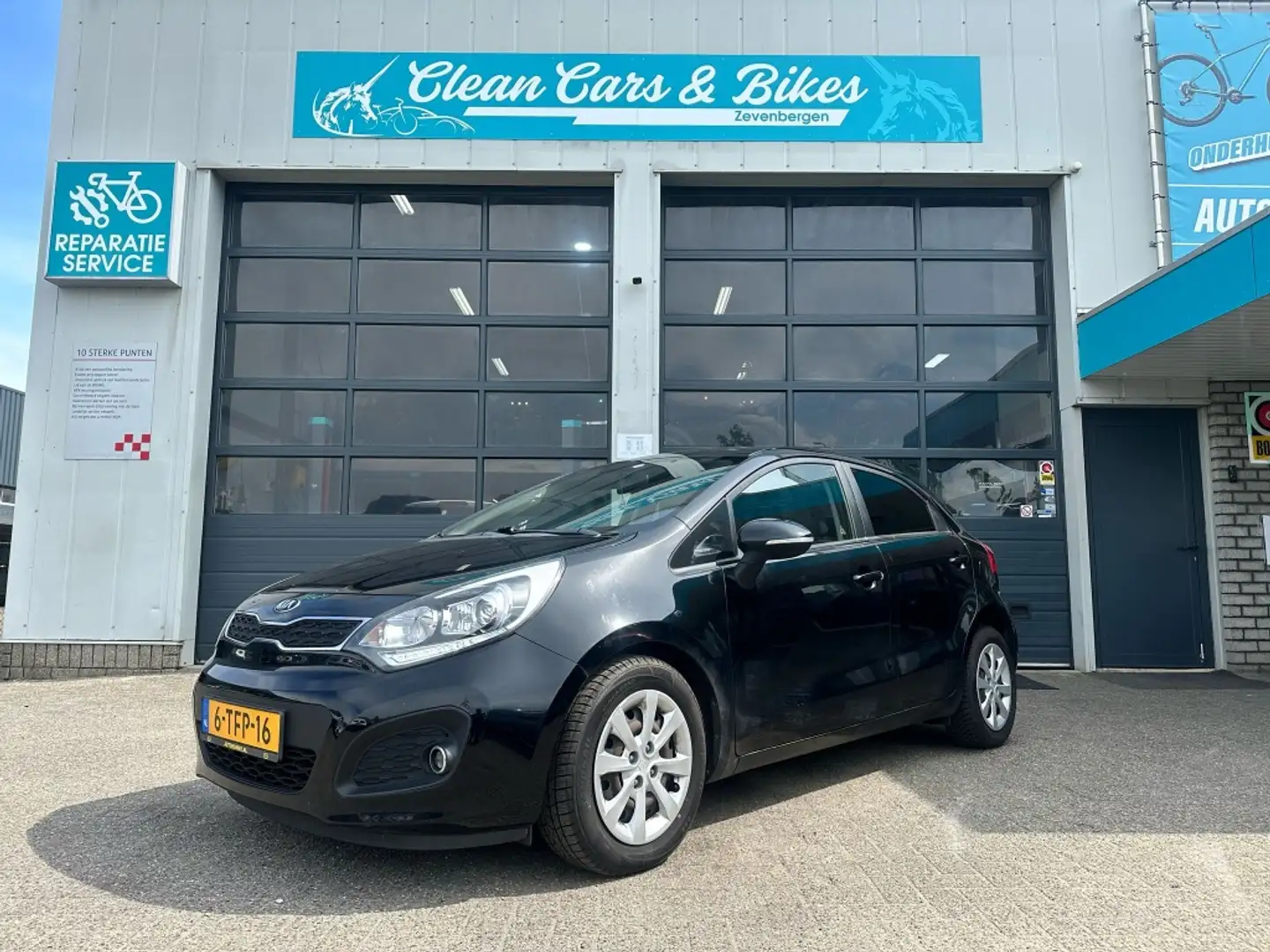 Kia Rio 1.2 CVVT Plus Pack Zwart - 1